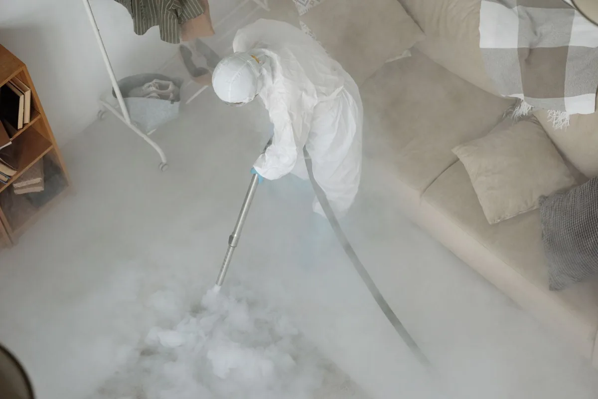 Biohazard cleanup technician in protective equipment, Nittany, PA